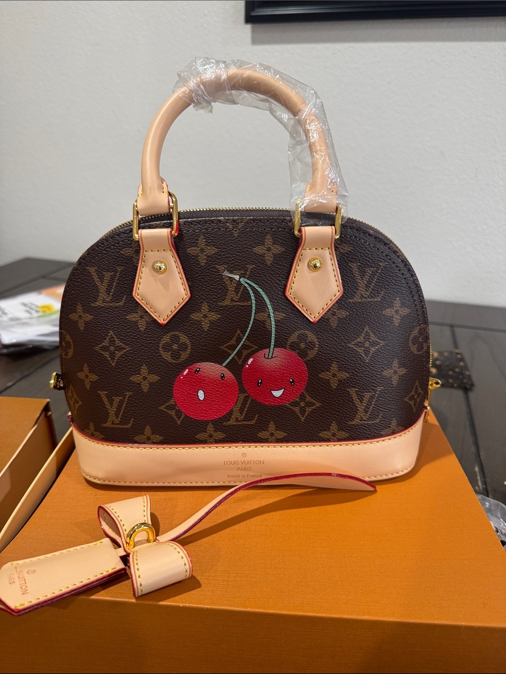 Brown Monogram Alma BB Satchel with Red Cherry Motif